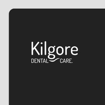 Kilgore Dental Care logo on a dark background